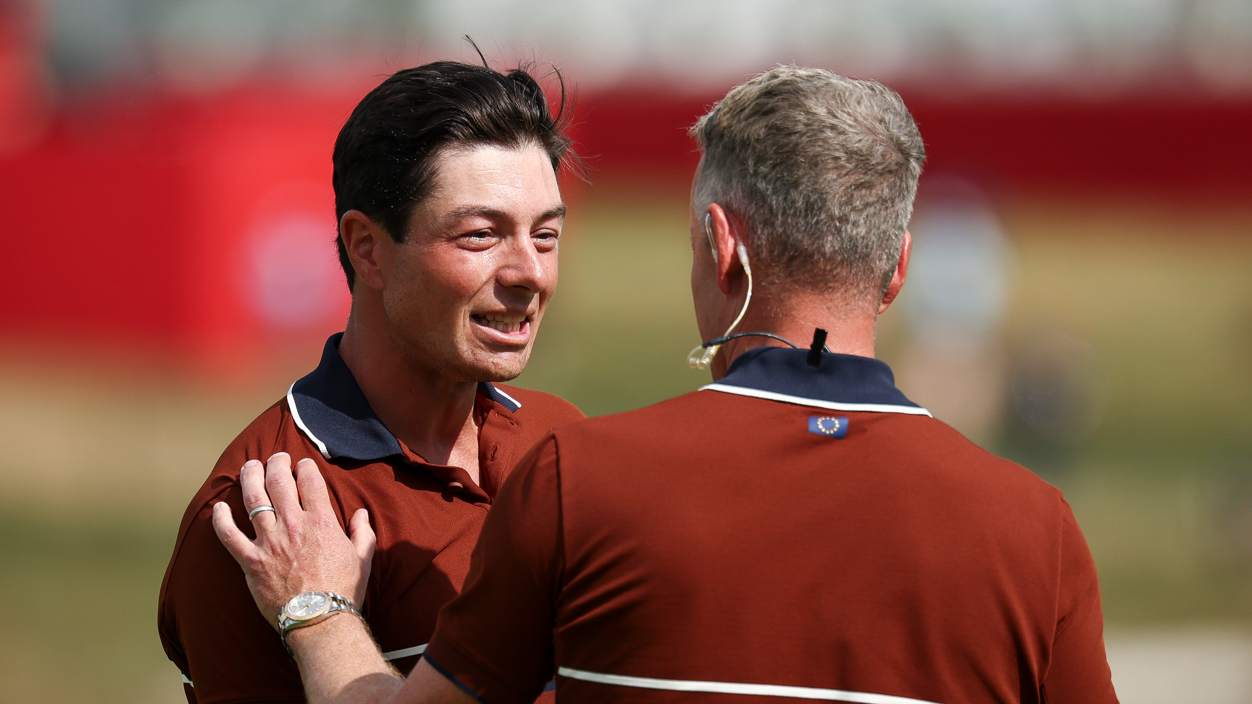 Viktor Hovland speaks to European captain Luke Donald during the 2025 Ryder Cup