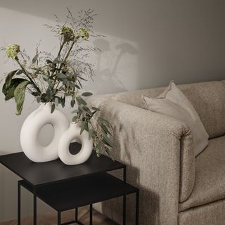 H&M Home doughnut vases on black side tables