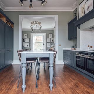 kitchen with wooden flooring and grey cabinet