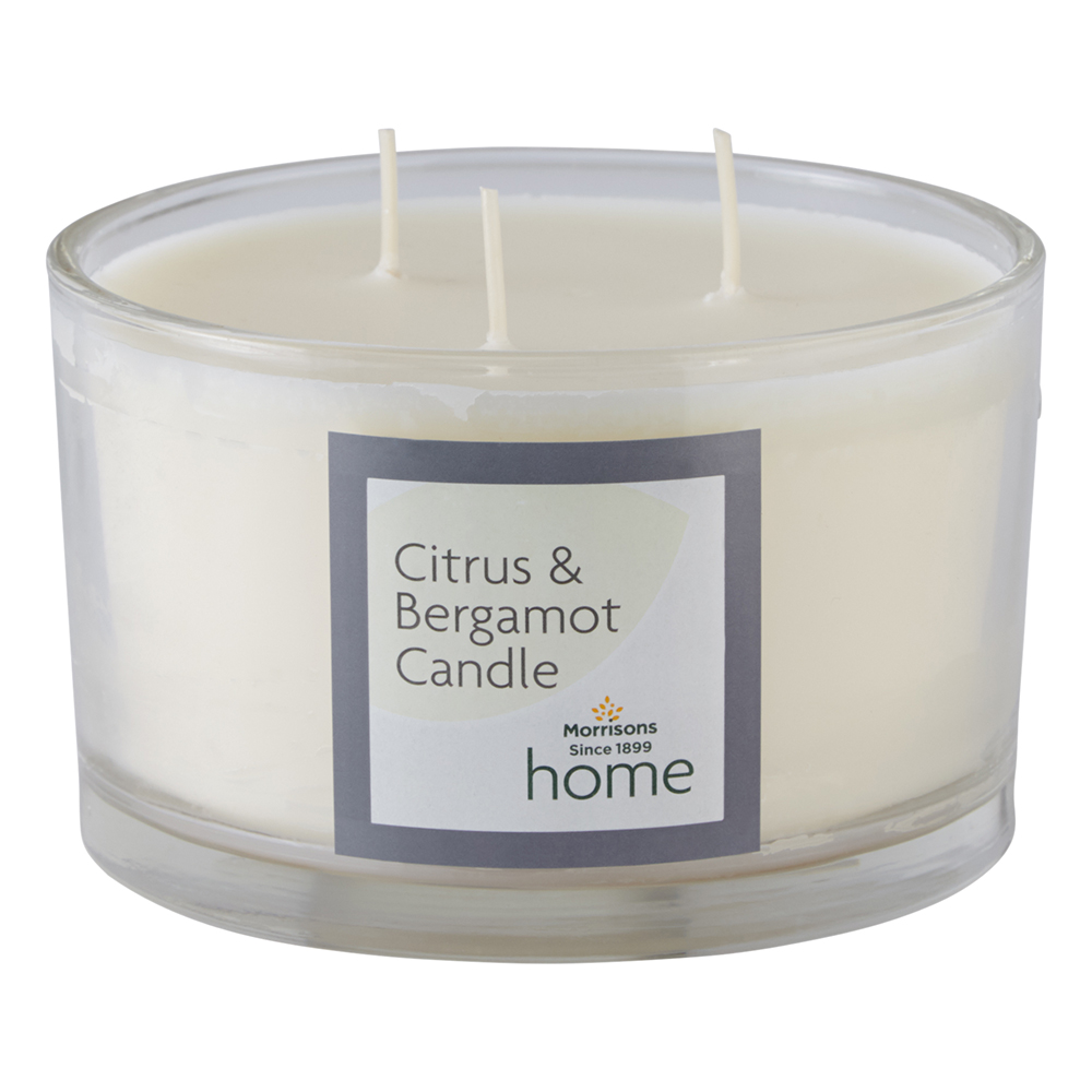 white candle with bergamot orange and lemon scents