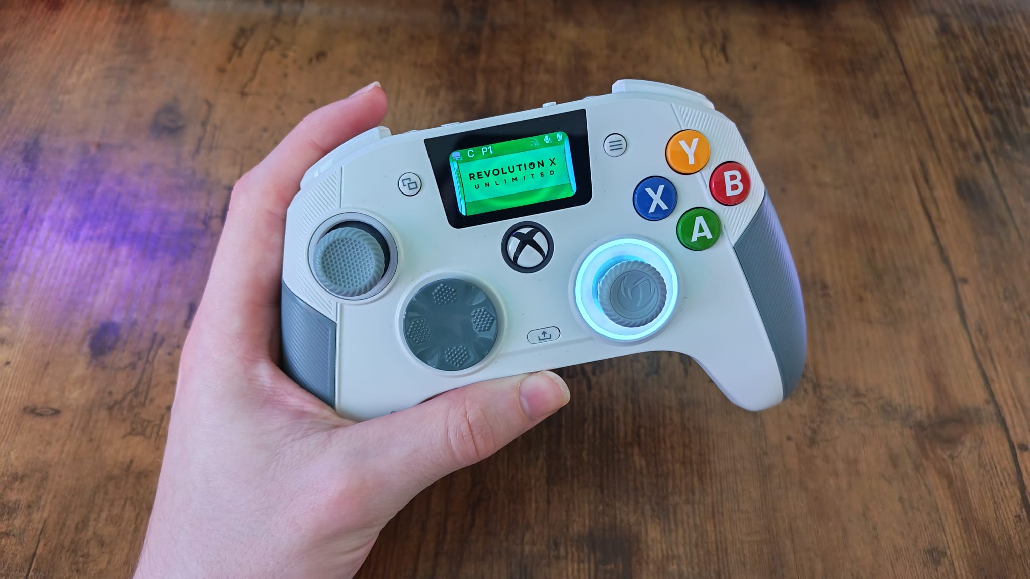 A reviewer holding the Nacon RXU 360 Edition