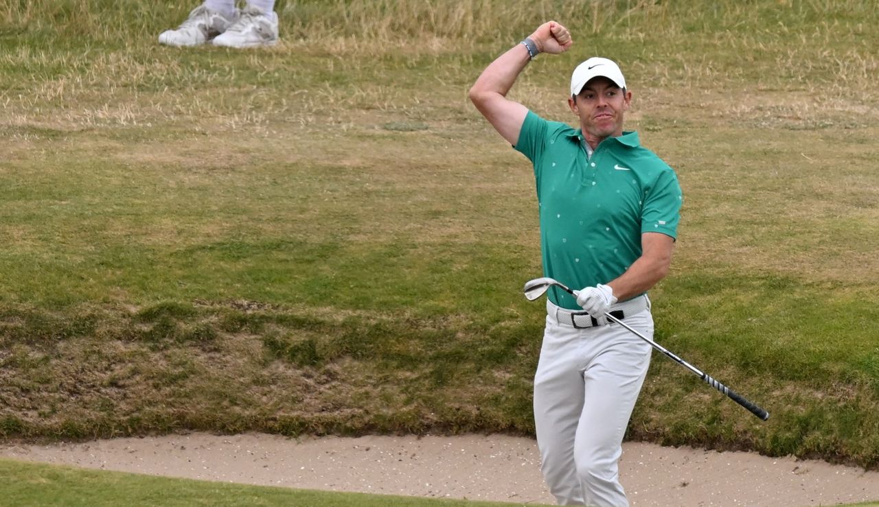 McIlroy celebrates after holing a bunker shot