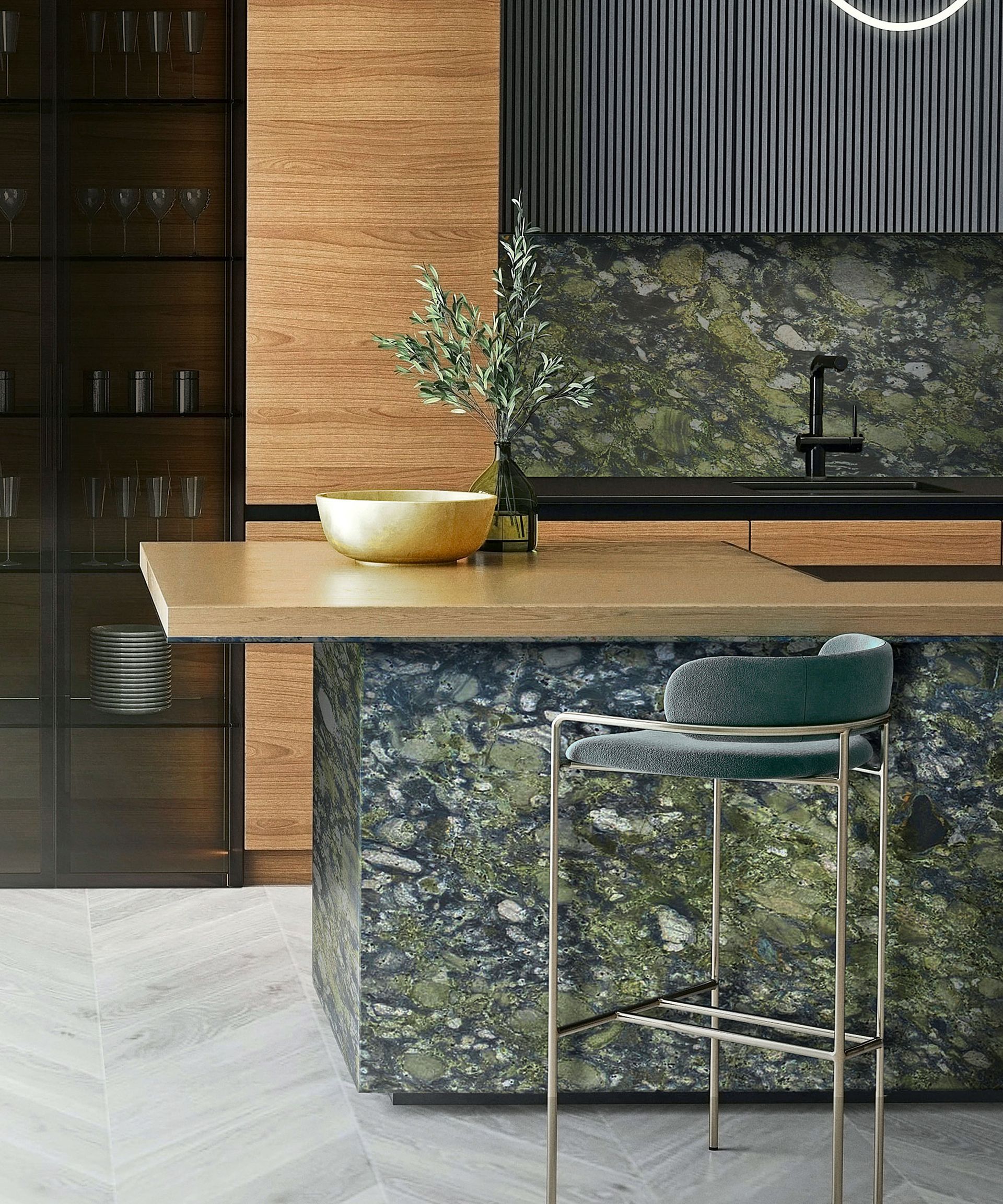 Kitchen with green marble backsplash and island