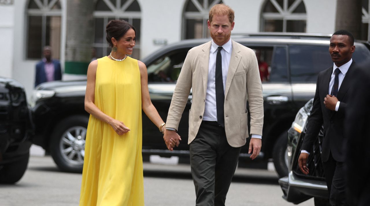 Meghan (L), Duchess of Sussex, and Britain&#039;s Prince Harry (R), Duke of Sussex arrive at the State Governor House in Lagos on May 12, 2024 as they visit Nigeria as part of celebrations of Invictus Games anniversary.