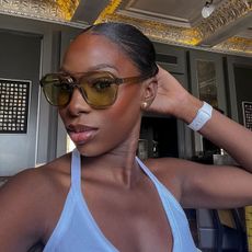 Creator @amagodson_a taking a selfie wearing oversized sunglasses