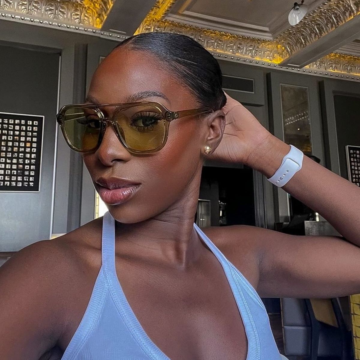 Creator @amagodson_a taking a selfie wearing oversized sunglasses