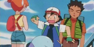 Ash with Misty and Brock getting scared in Pokemon: Johto.