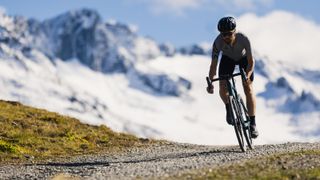 A rider on a gravel biking in the Swiss Alps