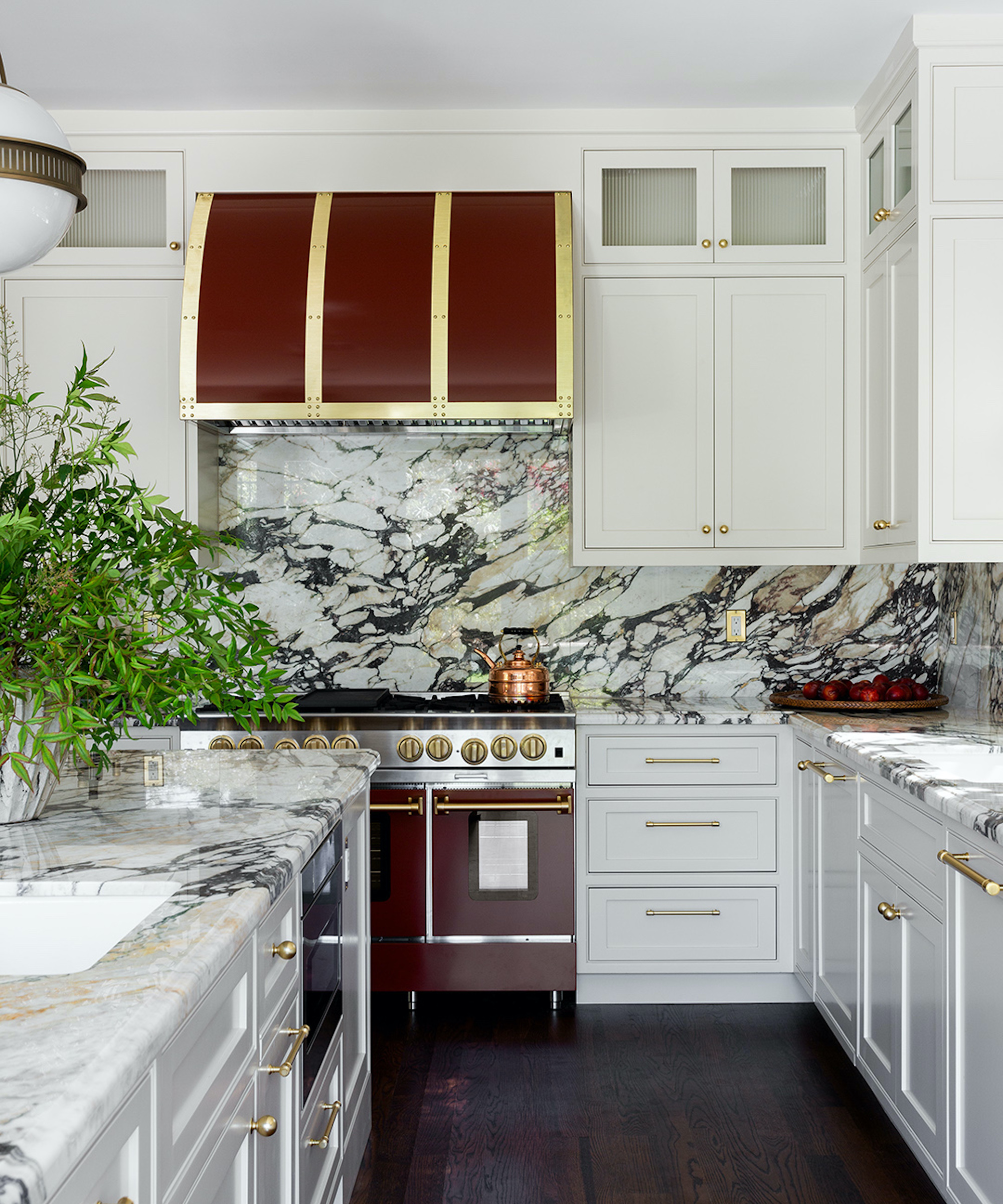 kitchen with white cabinets and burgundy appliances