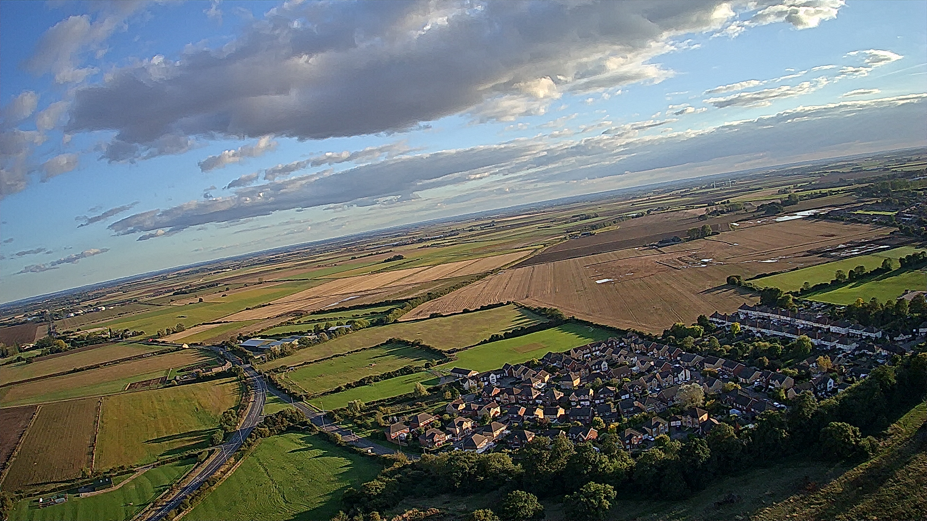 Aerial view of fields and houses taken with the Ruko U11MINI drone.