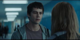 Dylan O'Brien as Fred in Flashback, appearing exhausted and concerned