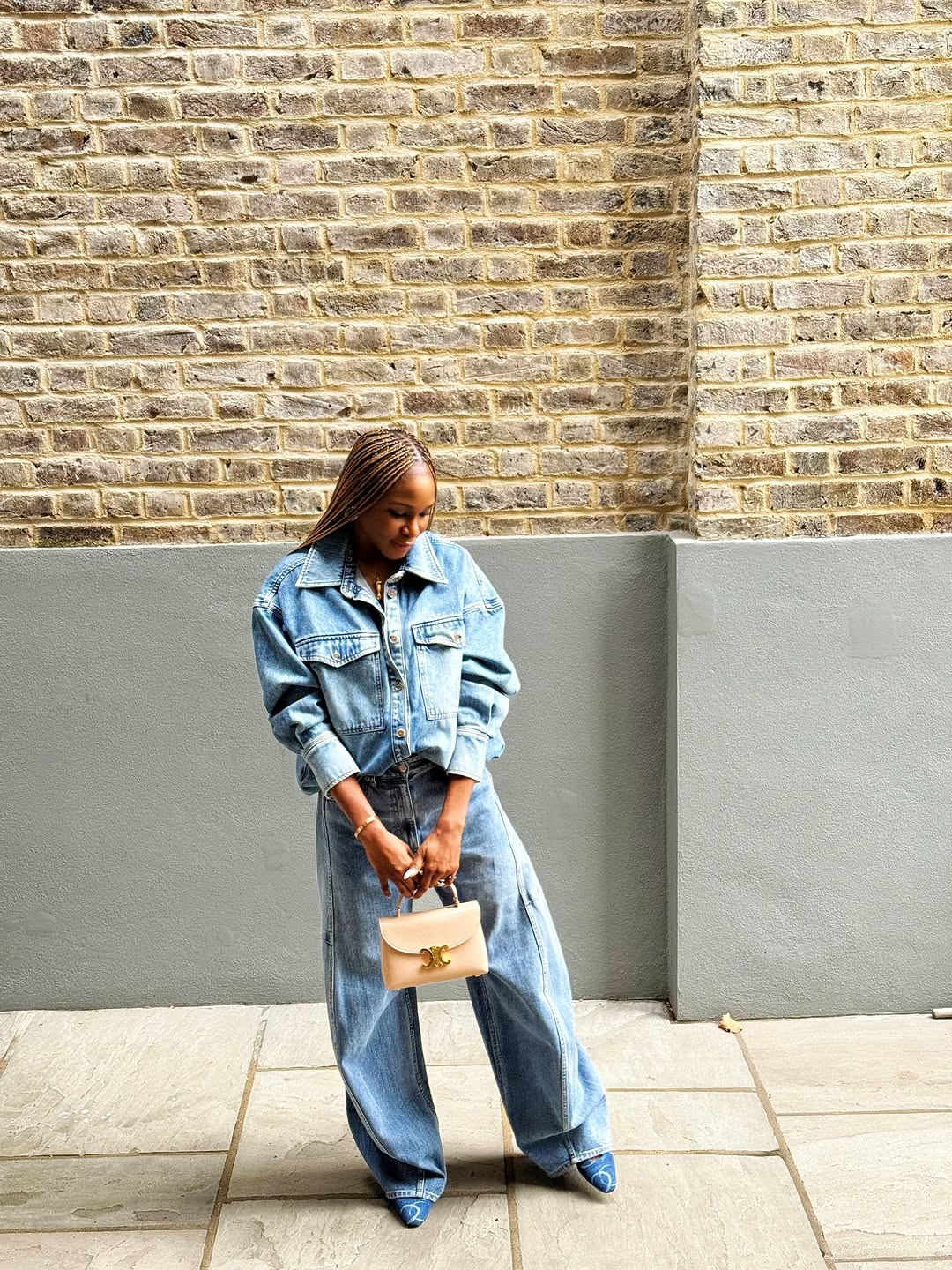 Woman wearing denim on denim outfit fall 2025.