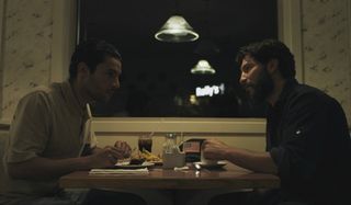 Jon Bernthal and Christopher Abbott sharing a meal in Sweet Virginia