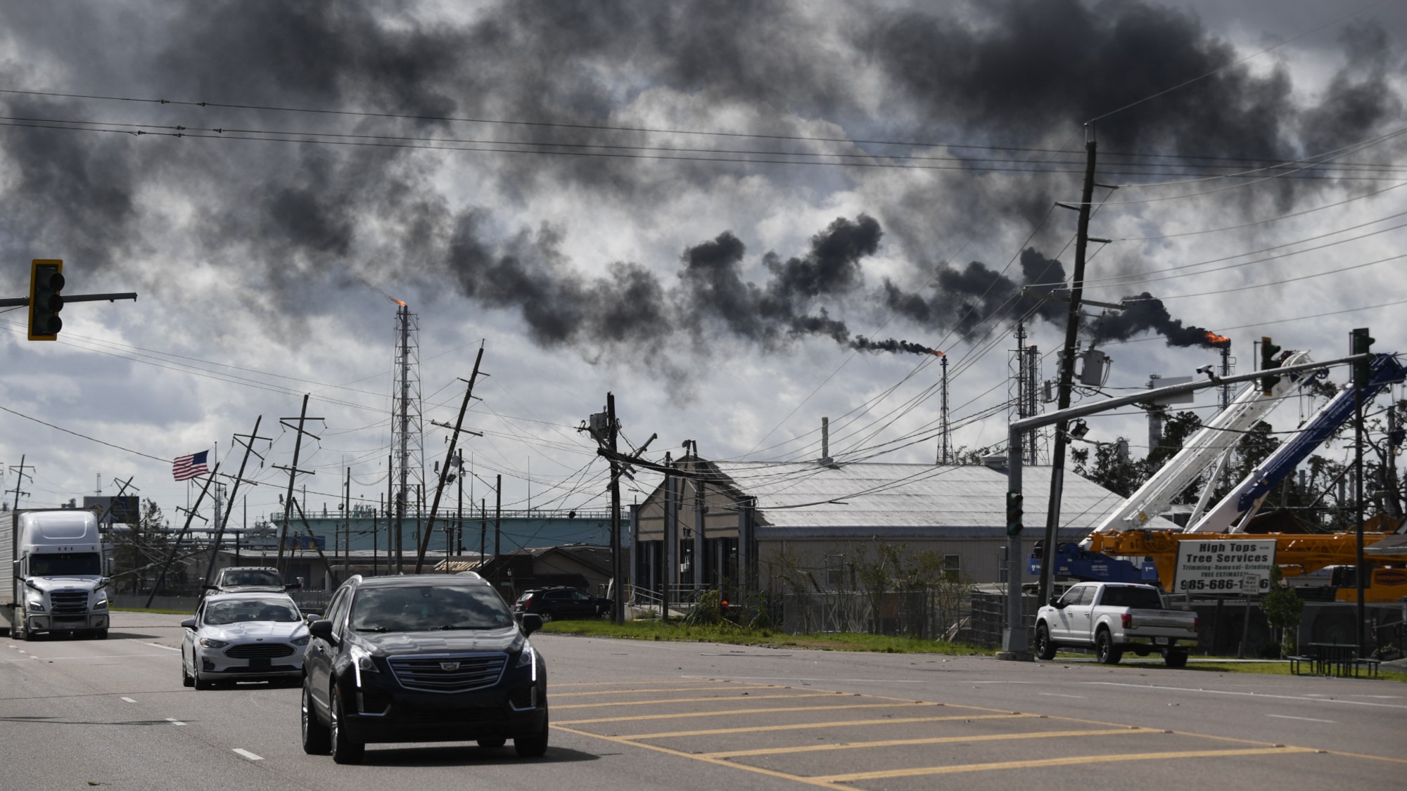 Cars drive past a chemical plant in Norco, Louisiana, in 2021.