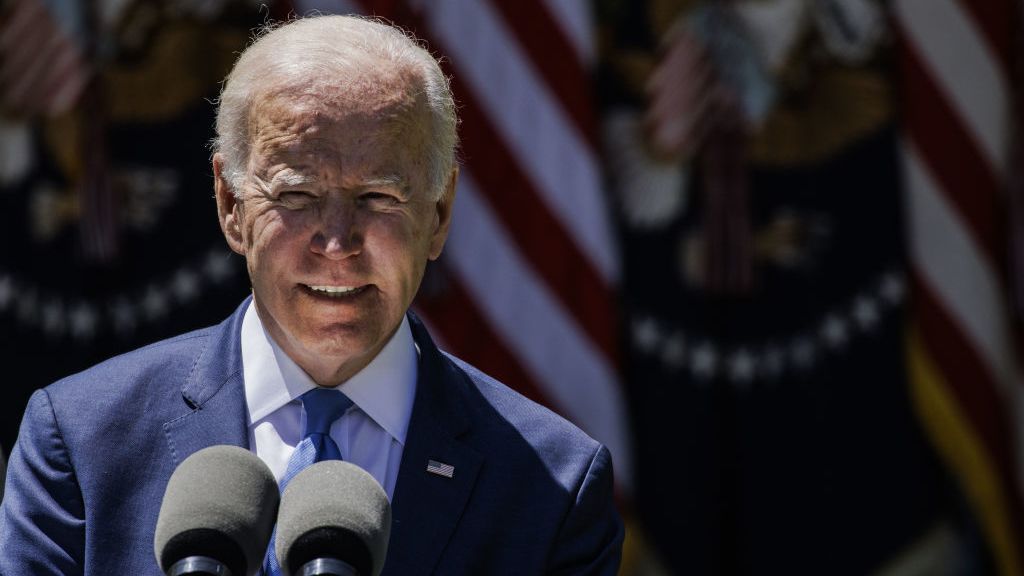 President Biden, delivering a speech on high-speed internet in front of a US flag