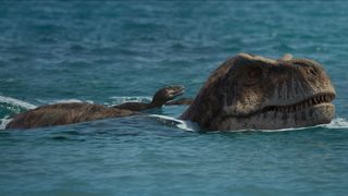 A Tyrannosaurus rex and juvenile swimming in episode 1 of “Prehistoric Planet.”