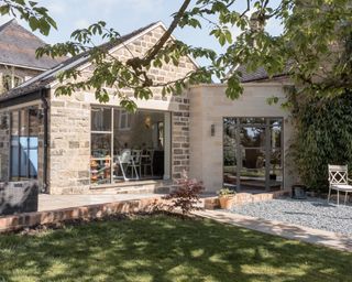 Converted detached double garage and extension facing garden