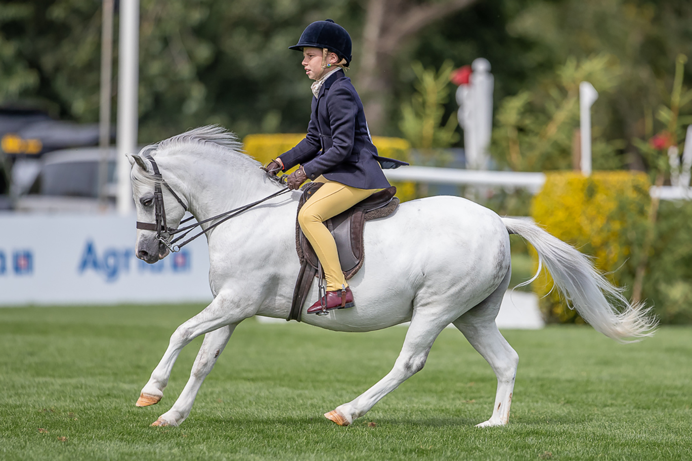 James Burchell and Rowfantina Orlando-Bloom lift the 2023 RIHS UKPH M&amp;M young riders supreme