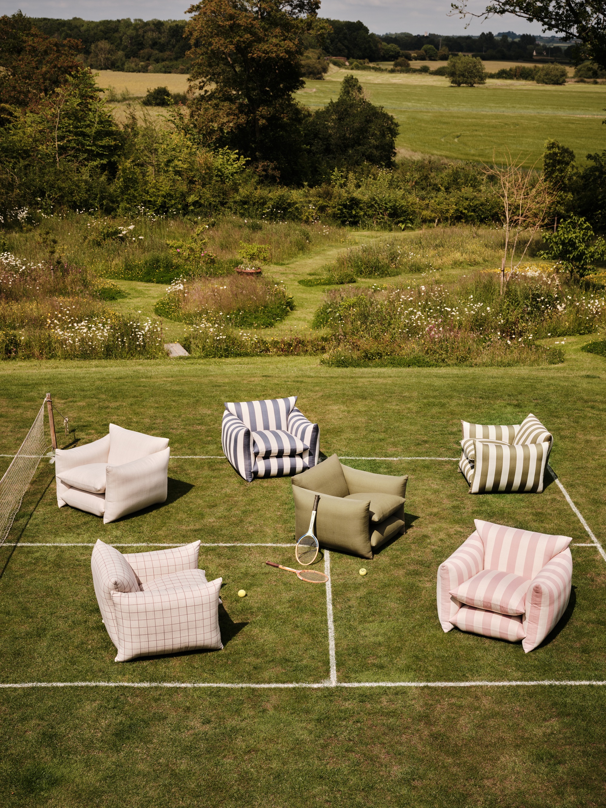 outdoor chairs on a tennis court in the countryside