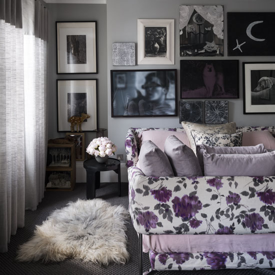 room with art of wall and sheepskin rug