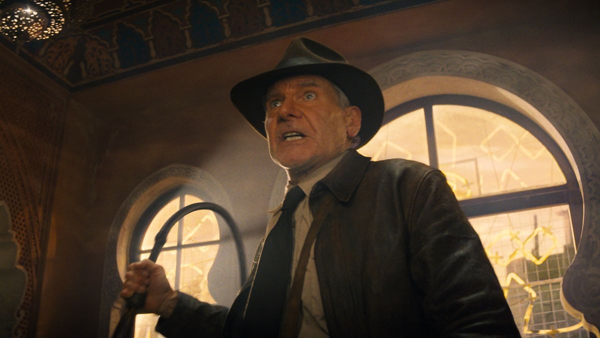 Harrison Ford&#039;s Indiana Jones holding whip in Indiana Jones and the Dial of Destiny