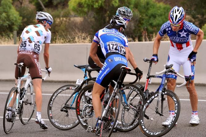 Riders untangle their bikes after a minor skirmish