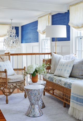 new england house style with sofa and blue fabrics