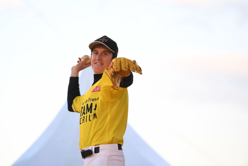 Geraint Thomas throws the ball