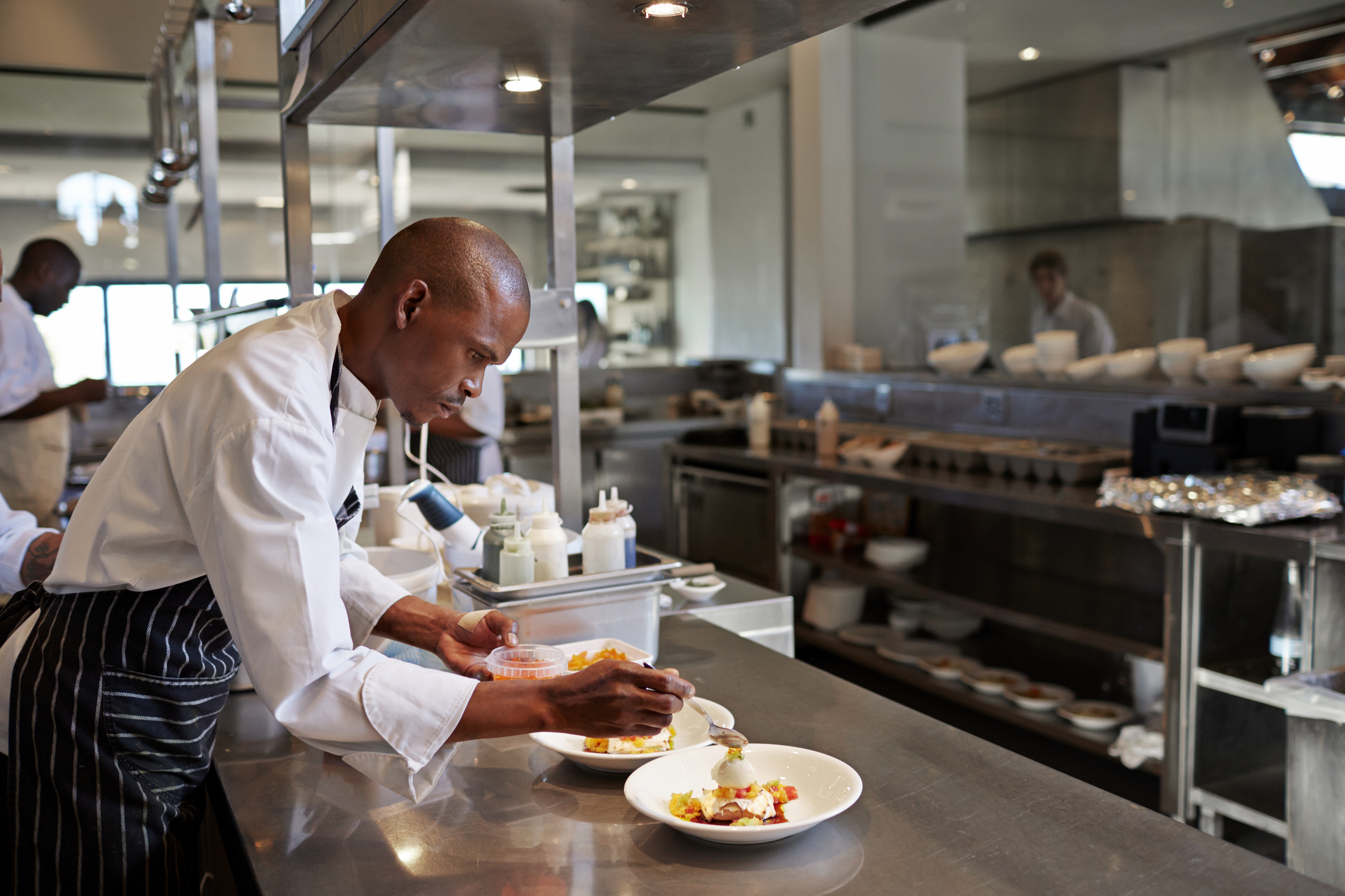 Chef preparing dish at restaurant