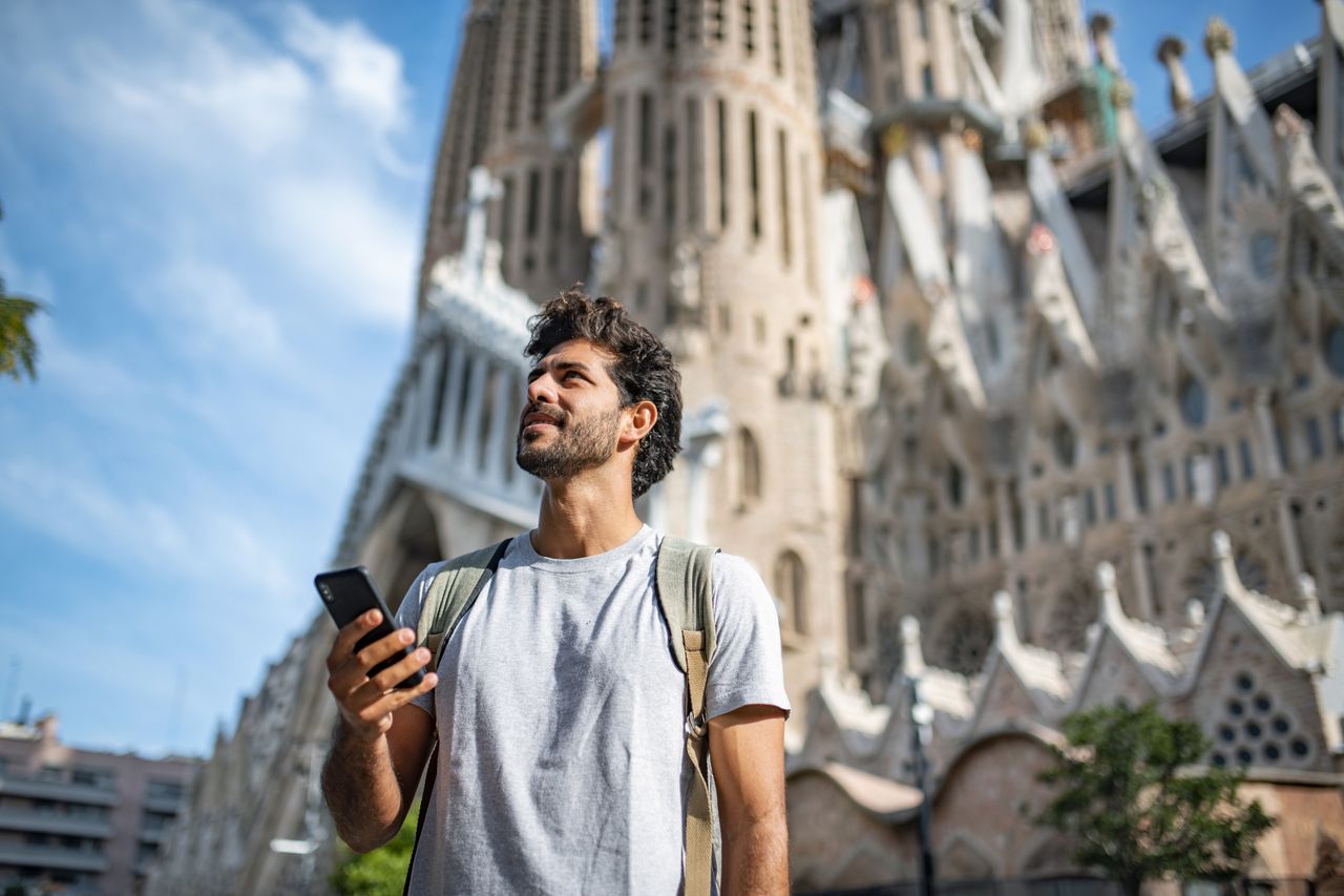 Mid Adult Male Tourist with Smart Phone in Barcelona 