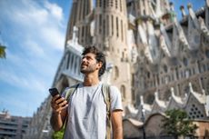 Mid Adult Male Tourist with Smart Phone in Barcelona 