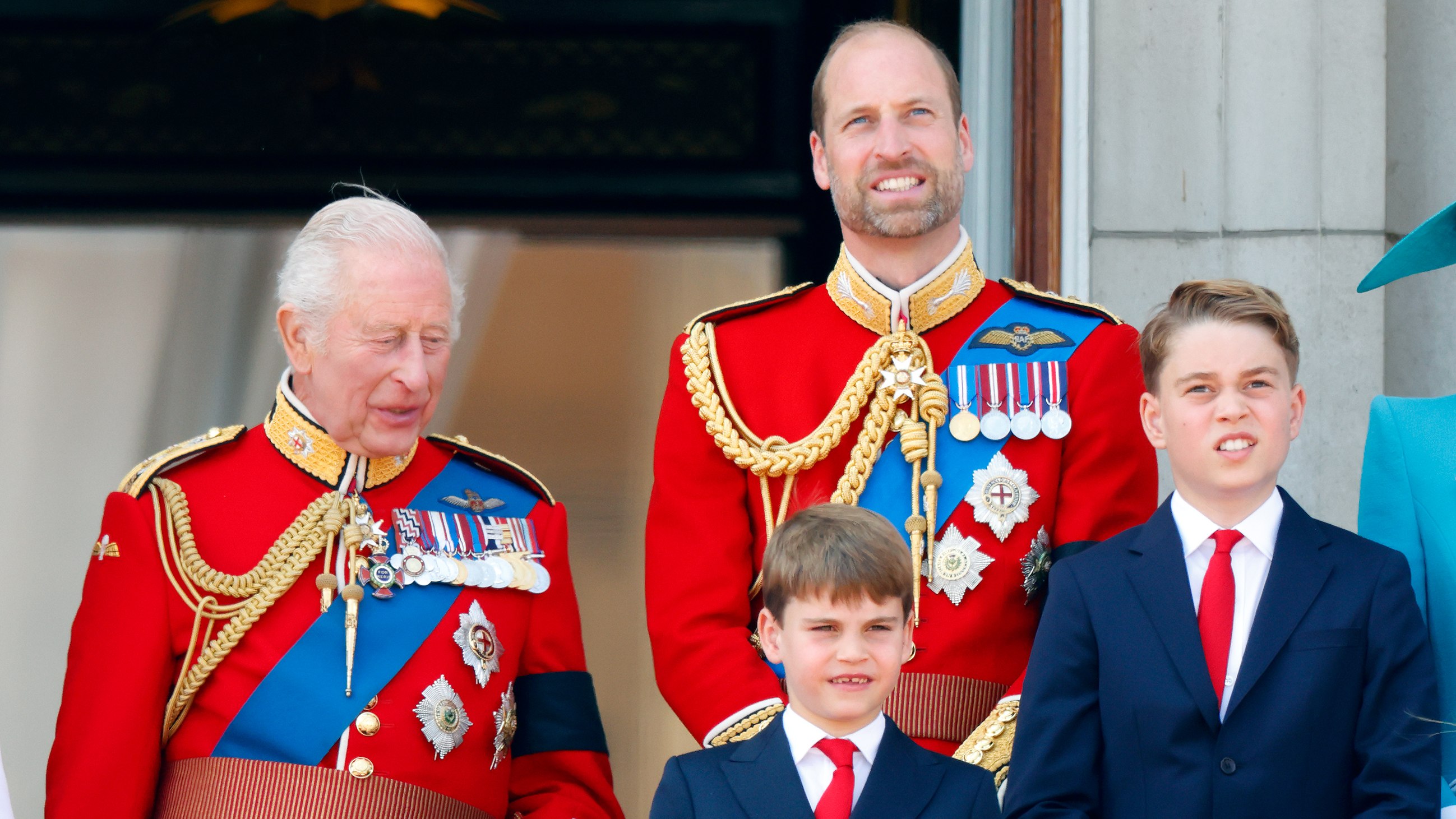 King Charles III (wearing his Coldstream Guards uniform), Prince Louis of Wales, Prince William, Prince of Wales (Colonel of the Welsh Guards) and Prince George of Wales watch an RAF flypast from the balcony of Buckingham Palace after attending Trooping The Colour 2025