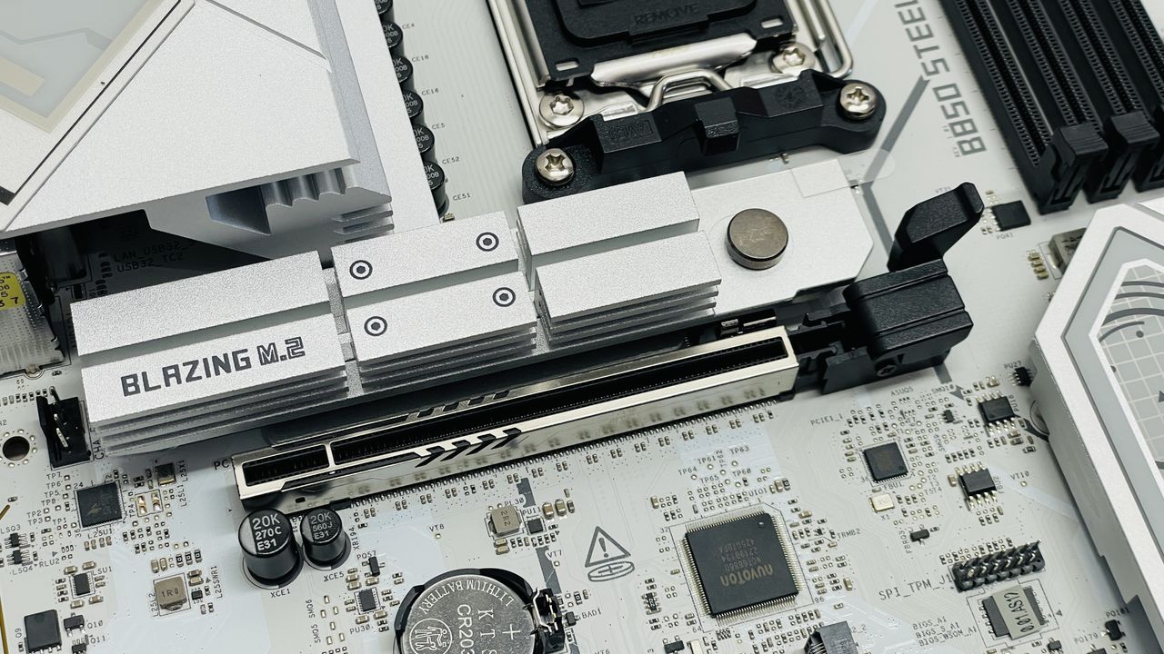 ASRock B850 Steel Legend Wi-Fi motherboard on a desk.