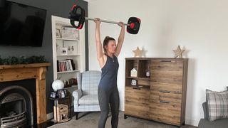 Personal trainer Lyndsey Hunter-Long performing an overhead press