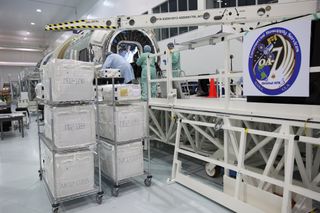 Tehcnicians and engineers at NASA's Kennedy Space Center in Florida load supplies and scientific research materials onto the Cygnus spacecraft's pressurized cargo module for the Orbital ATK CRS-7 mission to the International Space Station.