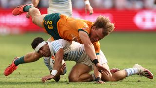 Australia player dives over Argentina player