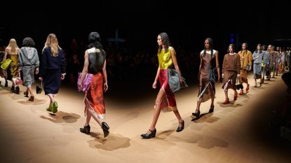 Women’s fashion week A/W 2023 preview featuring models on Prada runway