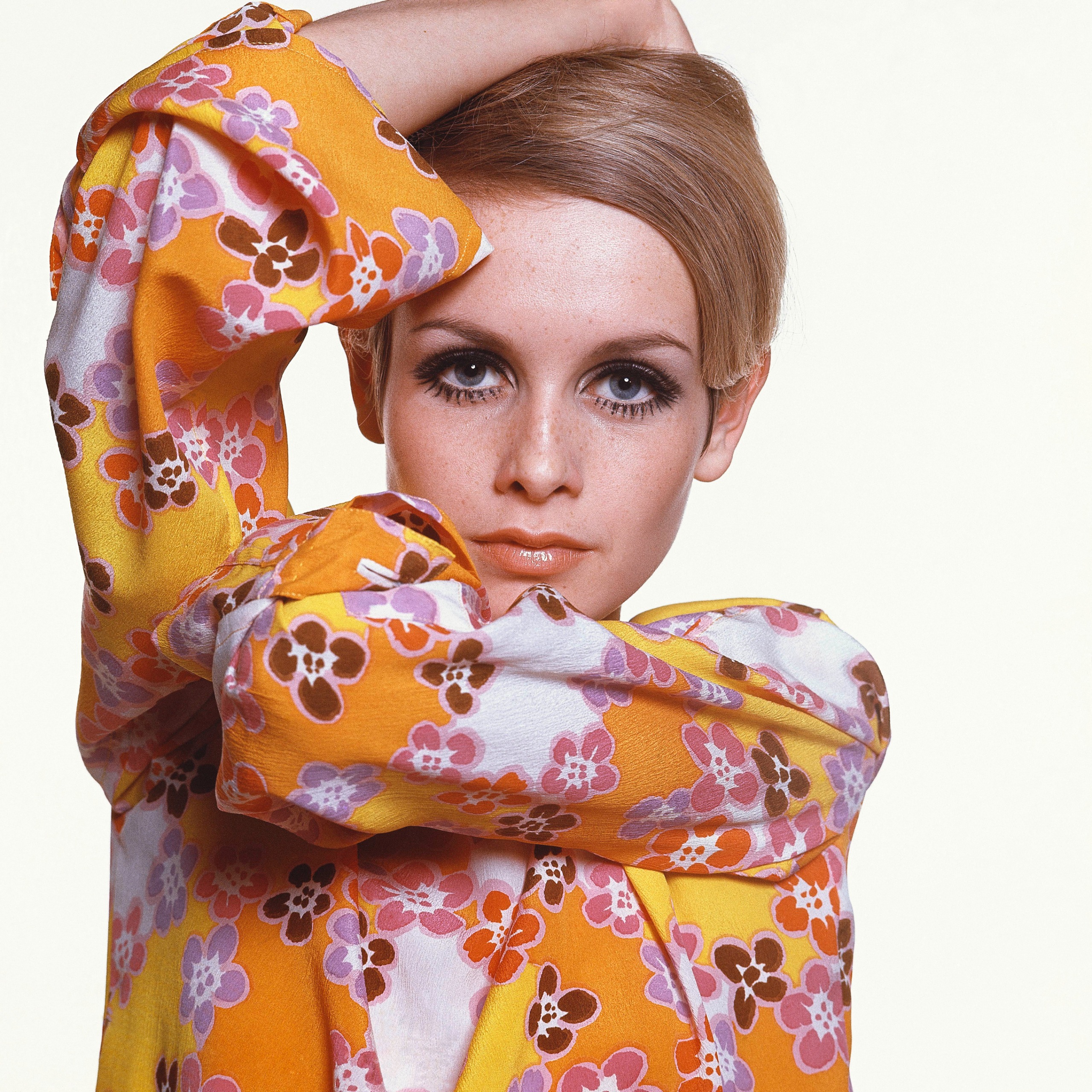 Twiggy in Max Factor make-up wearing flowered crepe dress by Michele Rosier.