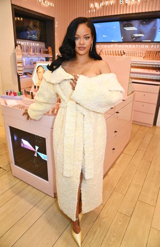 Rihanna attends the launch of Fenty Hair exclusively at Selfridges on September 16, 2024 in London, England wearing a shearling coat