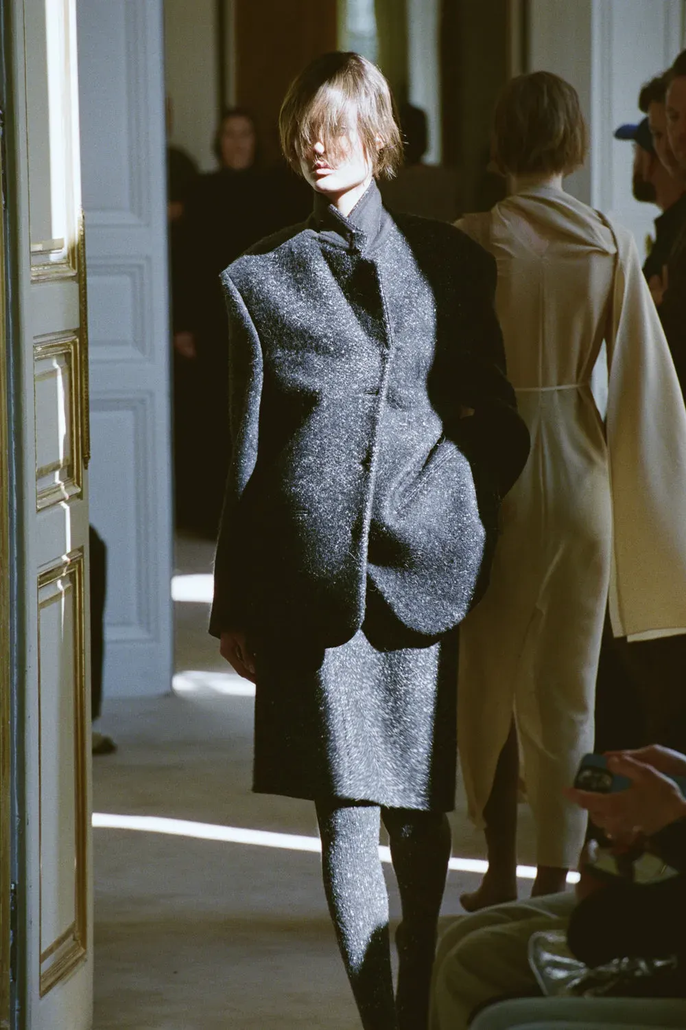 A model during the row resort 2026 show wears cashmere tights.