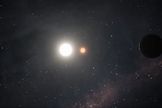 This screenshot from a NASA animation depicts the two known planets in the Kepler-47 system, as well as their double parent stars.