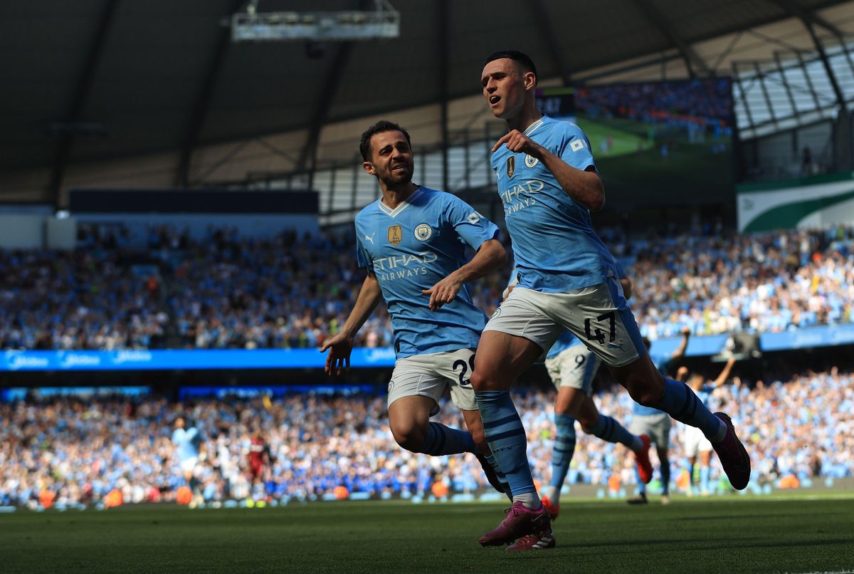 Phil Foden of Manchester City celebrates with teammate Bernardo Silva after scoring his side&#039;s first goal against West Ham United on the final day of the 2023/24 Premier League season