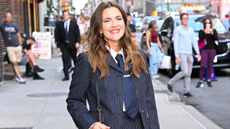 Drew Barrymore wears a pinstripe skirt suit