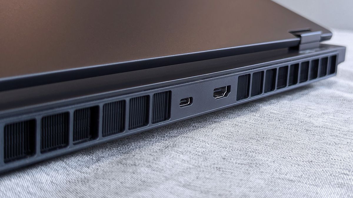 The rear side of a closed HyperX OMEN 15 laptop featuring rectangular cooling vents, a USB‑C port, and an HDMI port along the back edge.