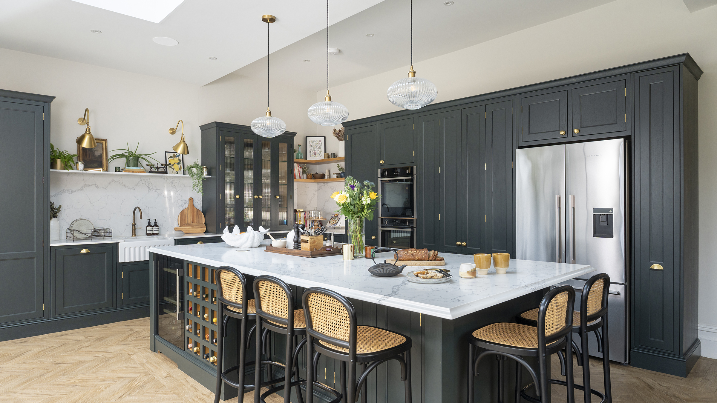 Black kitchen with lights over island