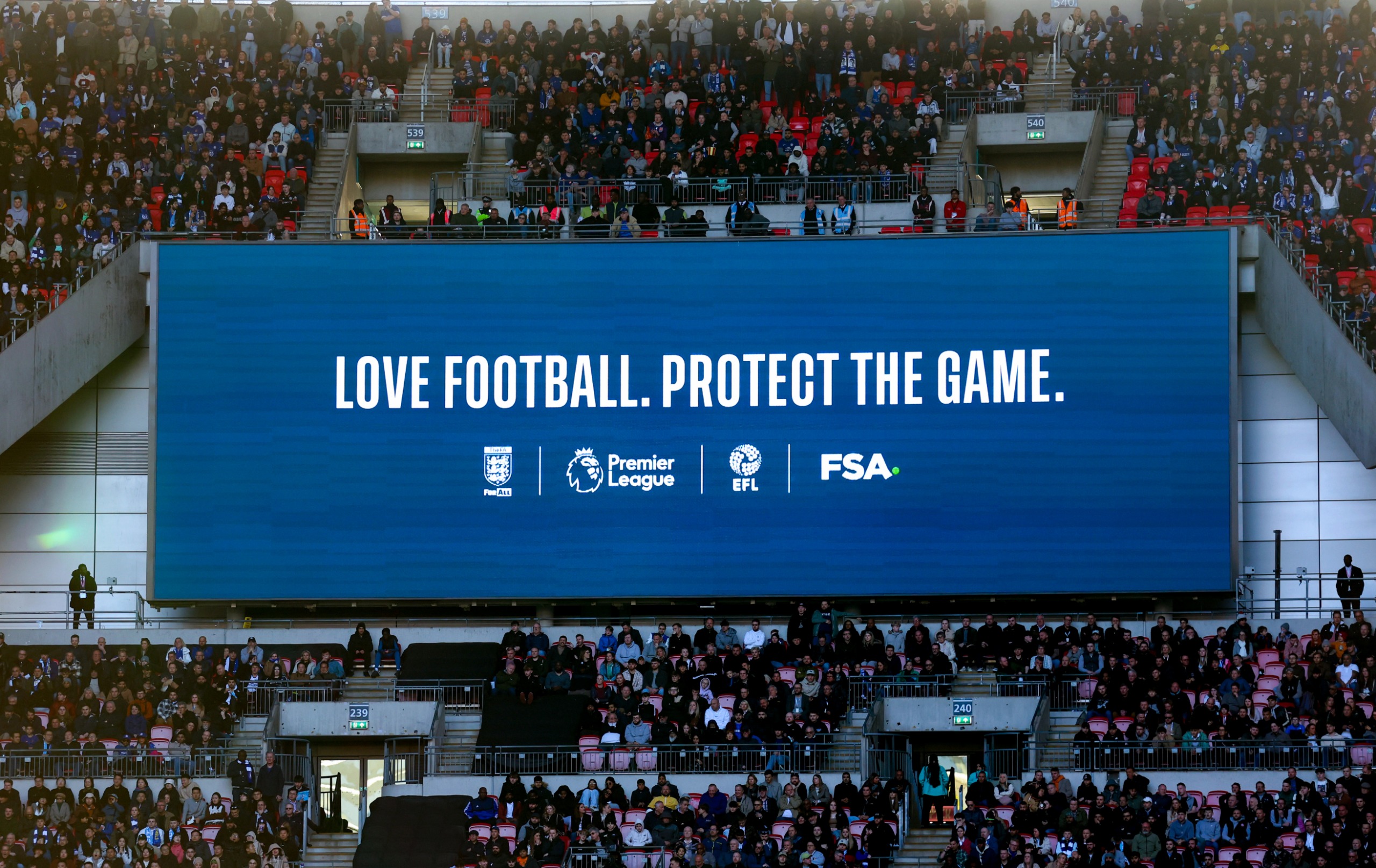 Video screen at Wembley: "Love football. Protect the Game."