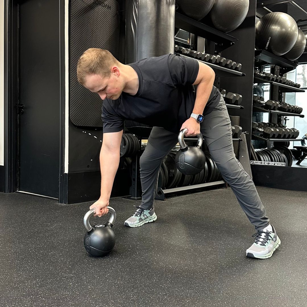Personal trainer Ollie Thompson demonstrating a gorilla row