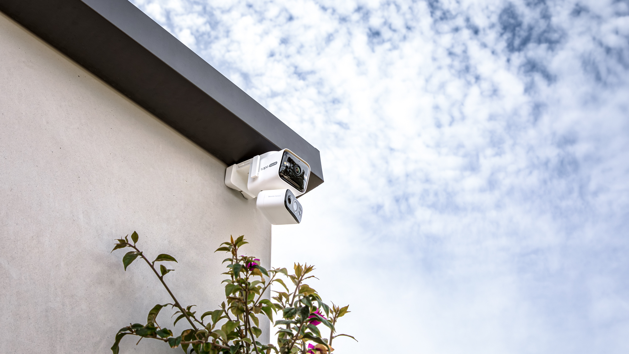 TP-Link Tapo C675D security camera mounted to a house