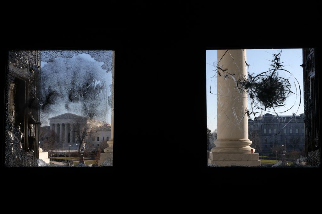 A shattered window at the Capitol.