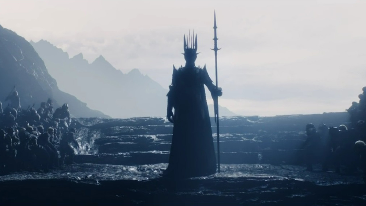 An imposing Sauron stands in his hideout with his orc army in The Rings of Power episode 1